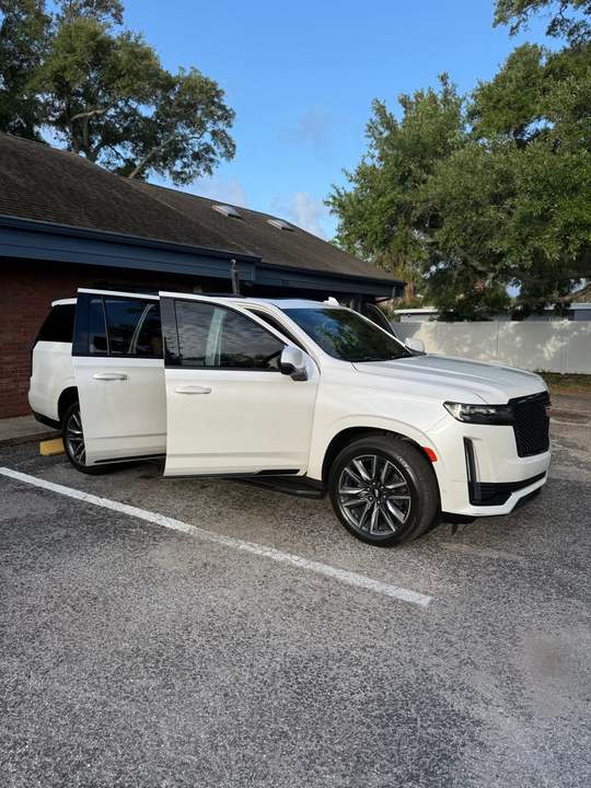 A white Cadillac Escalade gleaming after a full detail